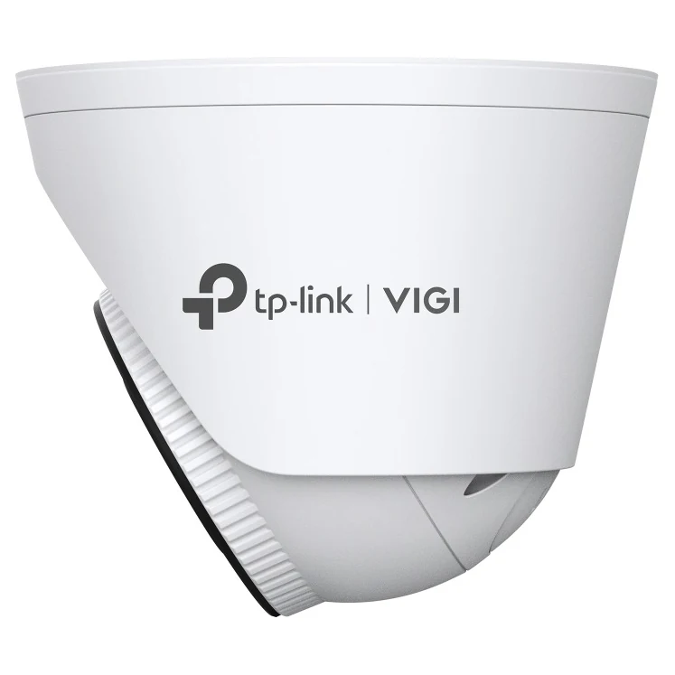 Dezelfde turretcamera van opzij; de kap met het logo en de geribbelde kantelring zijn goed te zien