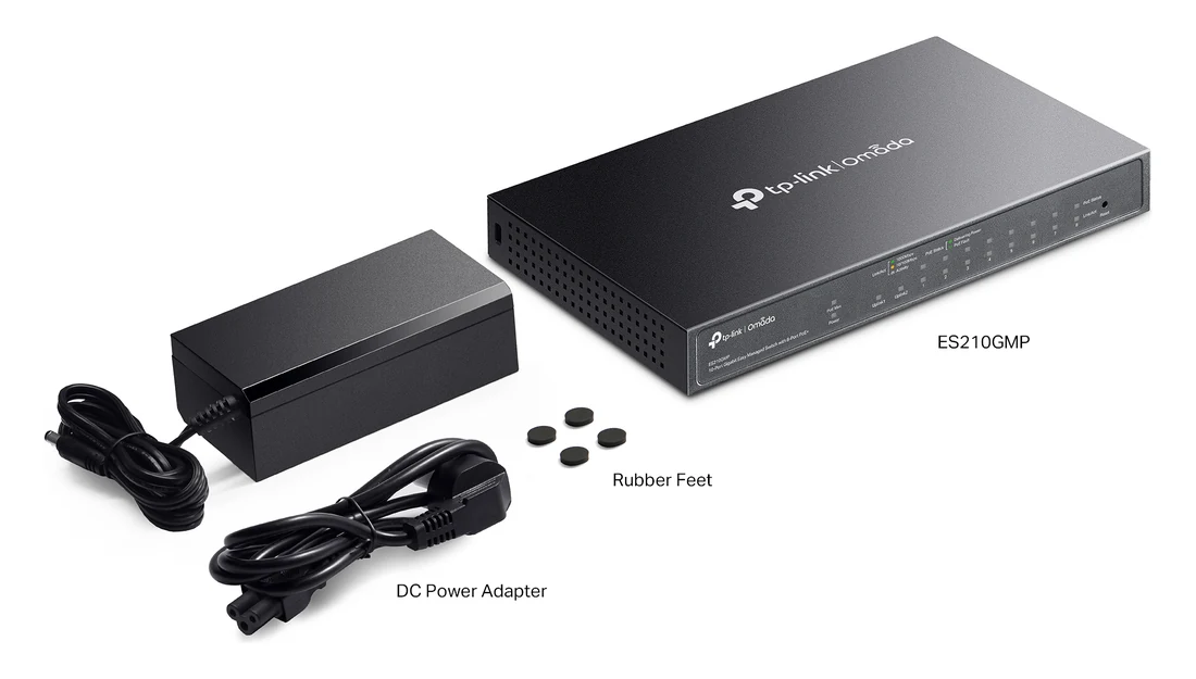 Doosinhoud van de ES210GMP: switch, voedingsadapter met netsnoer en vier rubberen voetjes